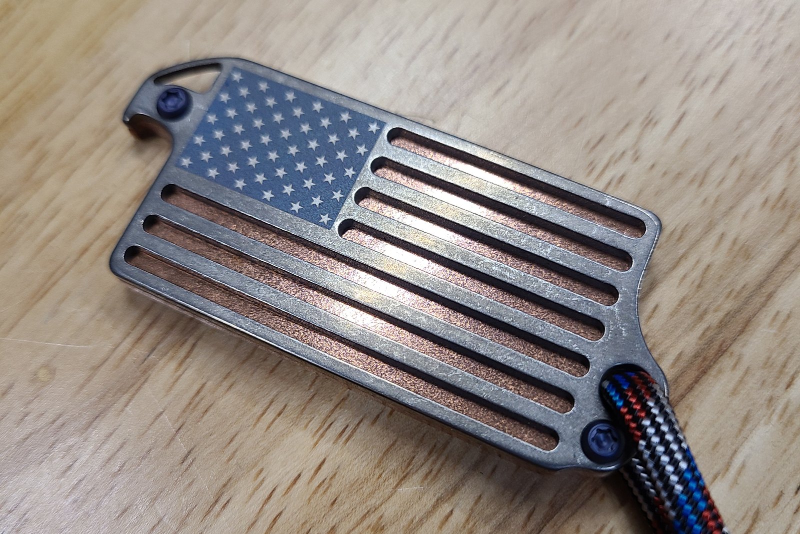 Red, White, & Brew flag bottle opener on a wood surface