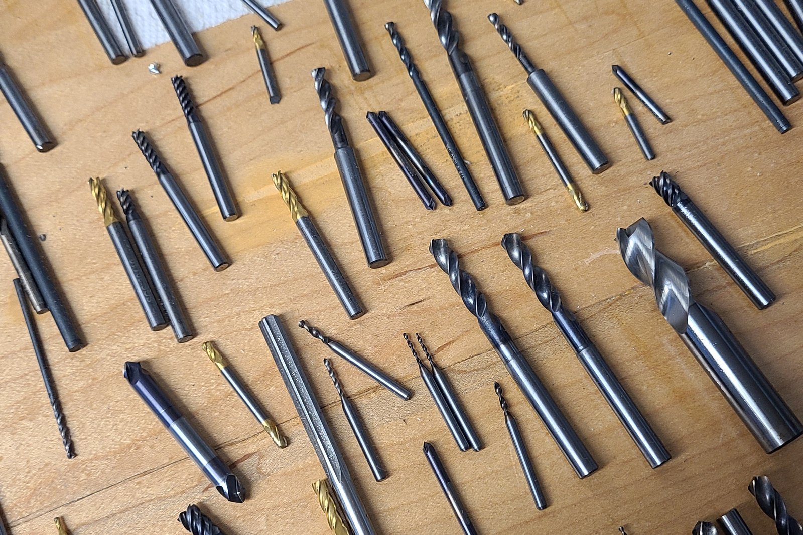 End mills and drills laid out on the bench