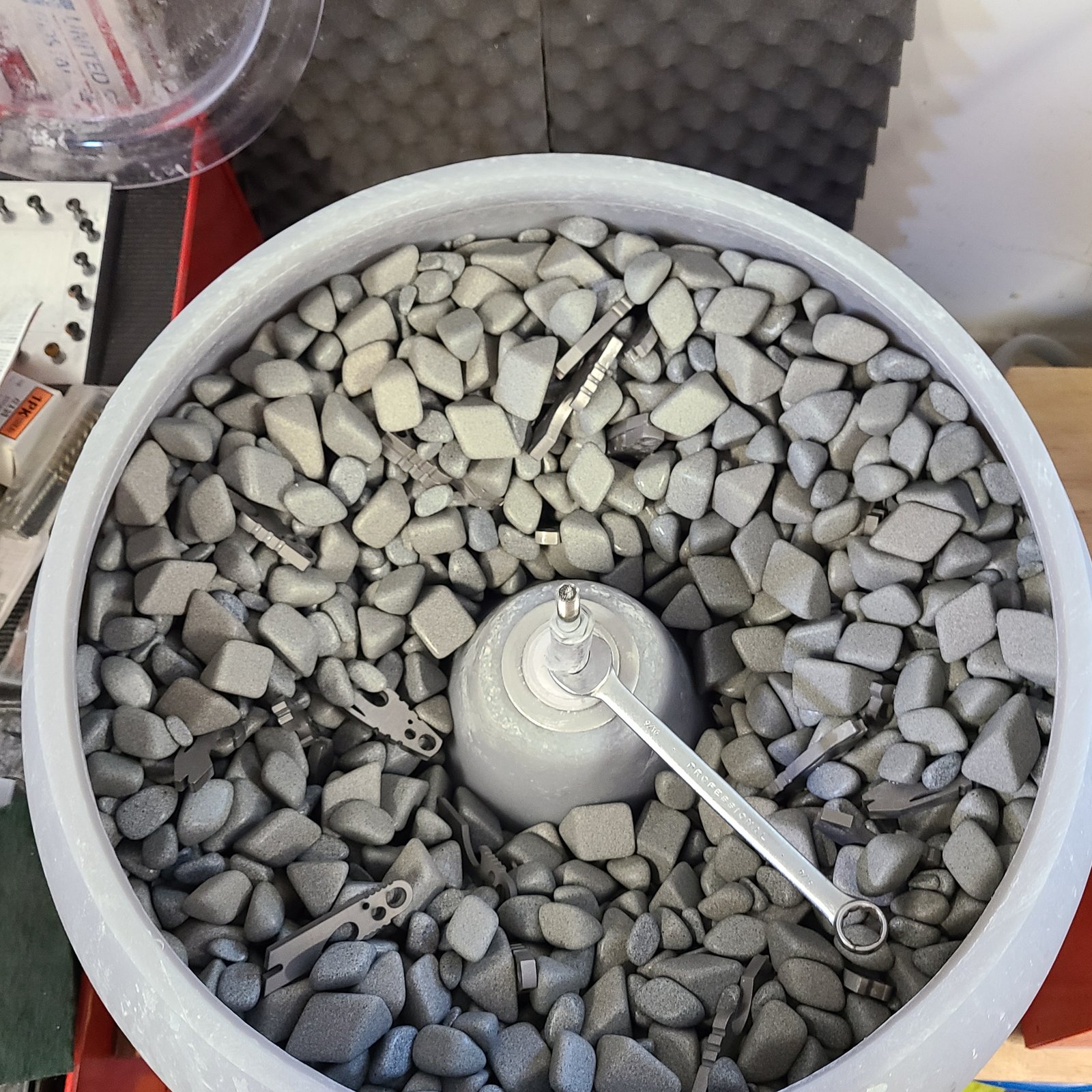 Vibratory tumbler bowl with ceramic media and parts